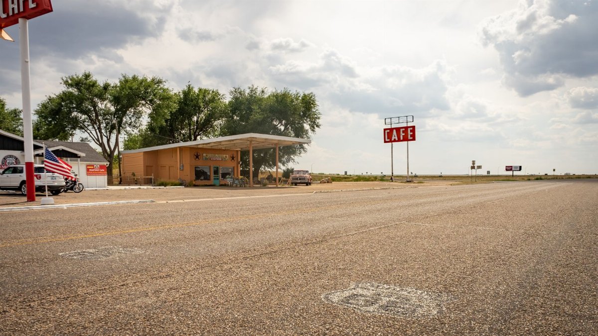 Iconic Midpoint Café on Route 66, featuring retro charm with a vast highway view.