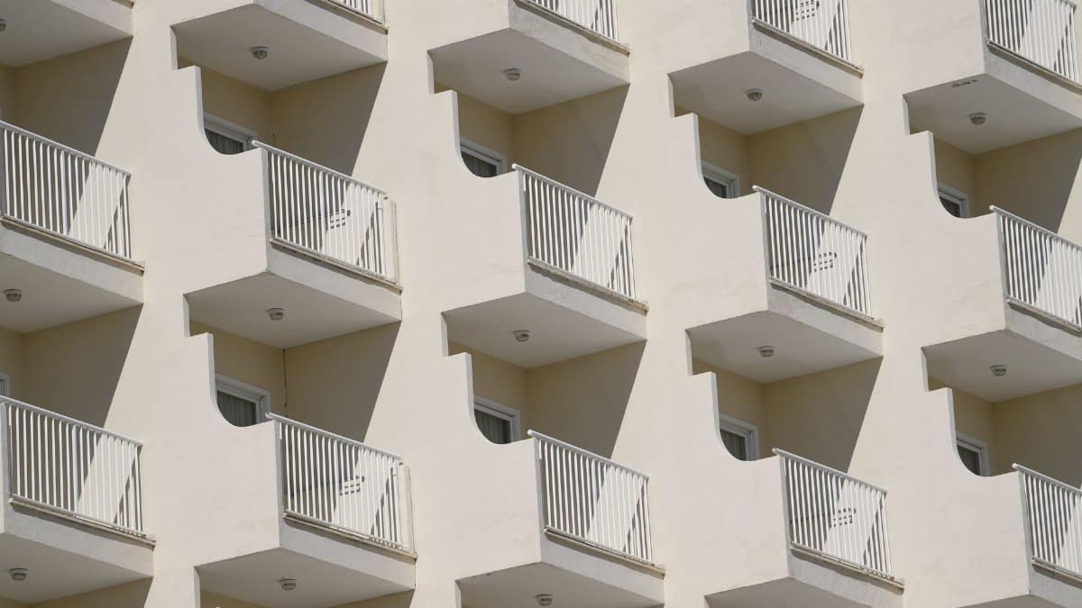 Sunlit balconies of a modern apartment building in the Balearic Islands, Spain.