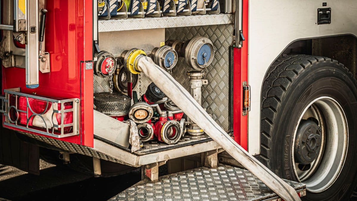 Close-up view of fire truck compartment with hoses and equipment in Wrocław, Poland.