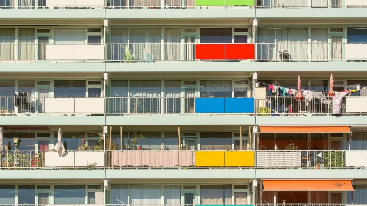 A vibrant display of colorful balconies on a residential building. Perfect for urban lifestyle themes.