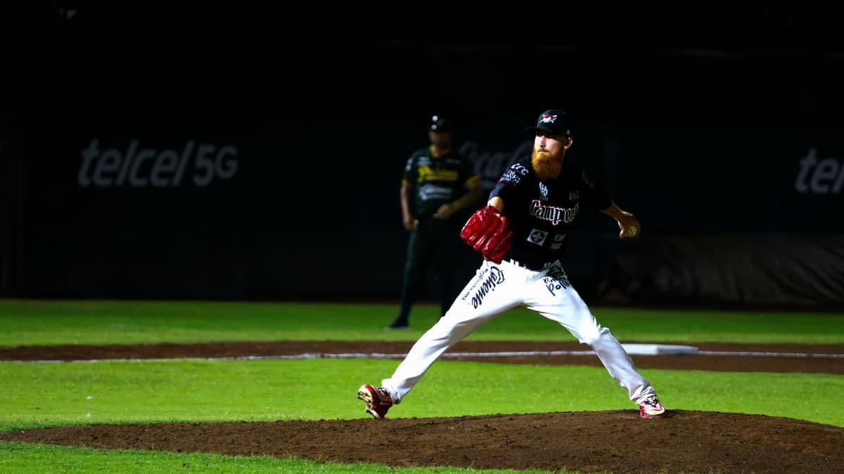 A baseball pitcher throws a pitch during a night game in San Francisco de Campeche, Mexico.