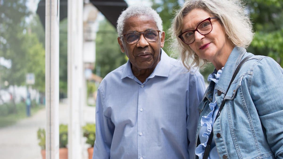 Charming senior couple spending time together in a park in Portugal.