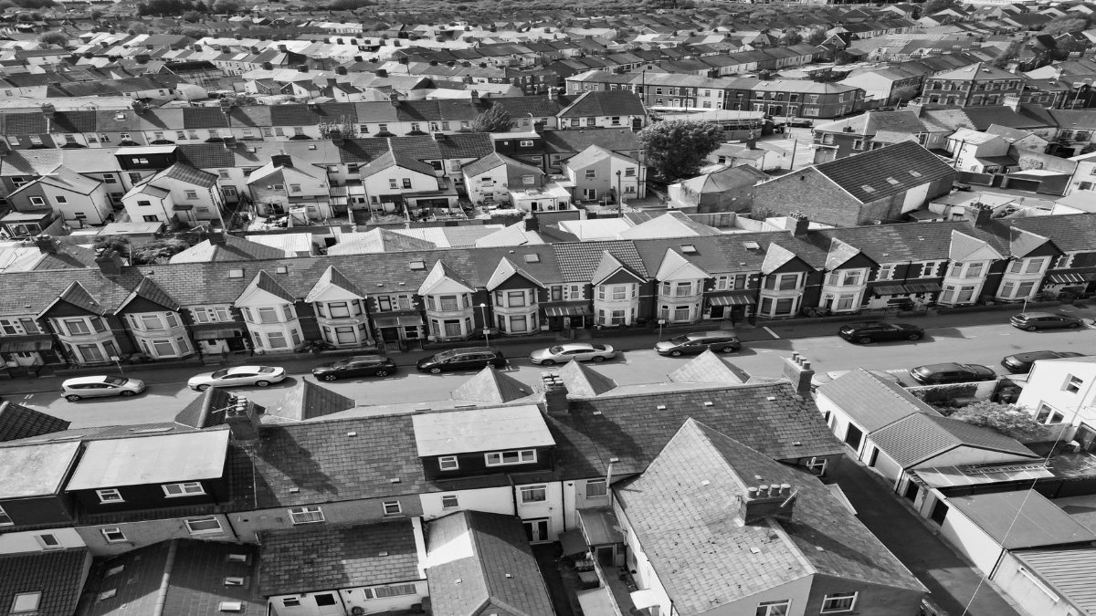 Black-and-white aerial shot capturing rows of suburban homes in Cardiff, Wales.