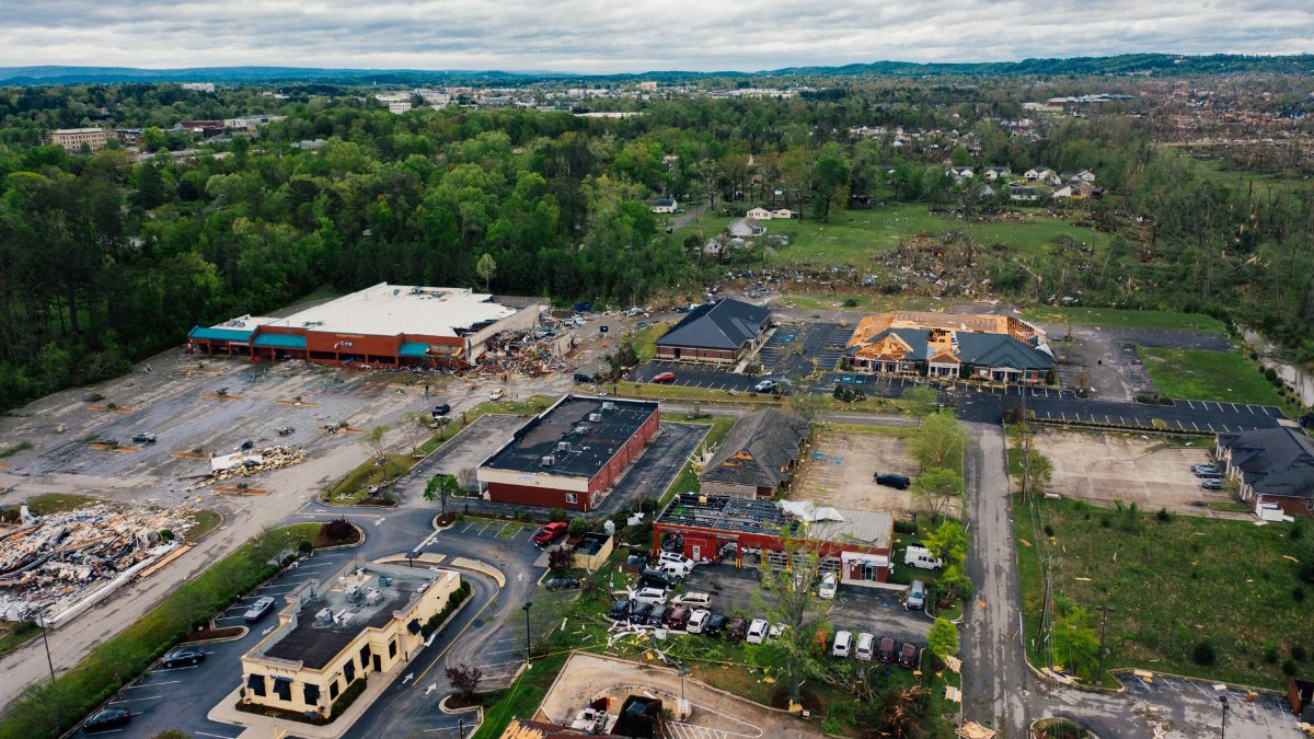 Drone view suburb district buildings with ruined destroyed roofs after strong windstorm