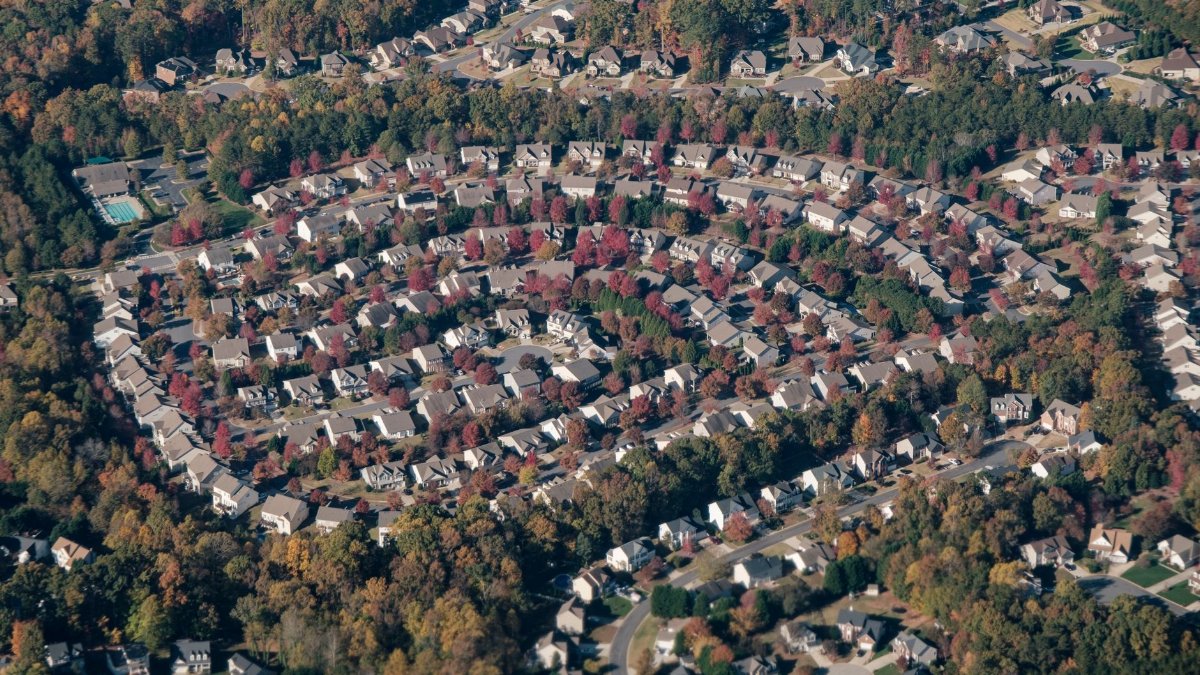 Aerial shot of a circular neighborhood in Fort Mill, SC, showcasing fall foliage and suburban layout.