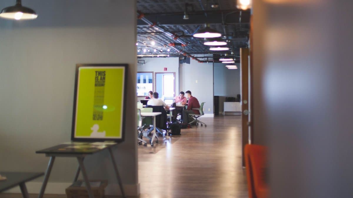 Contemporary open office space with people collaborating and working together.