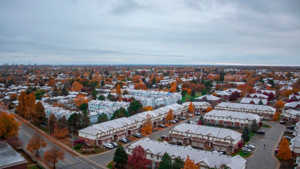 Scenic aerial view of suburban Kitchener, Ontario in fall with colorful foliage.