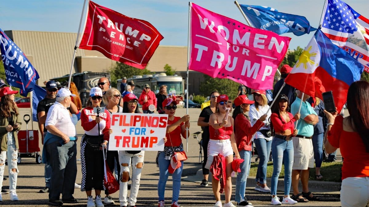 A group of diverse supporters at a political rally in Michigan.