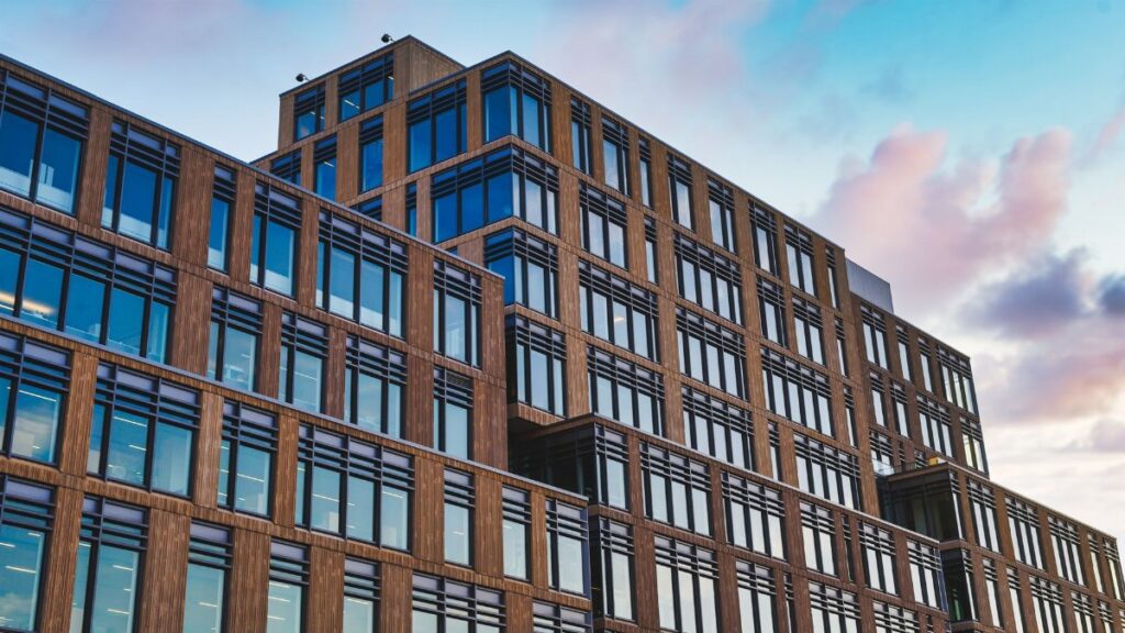 Exterior of big office building in modern design style under clear blue sky