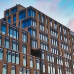 Exterior of big office building in modern design style under clear blue sky