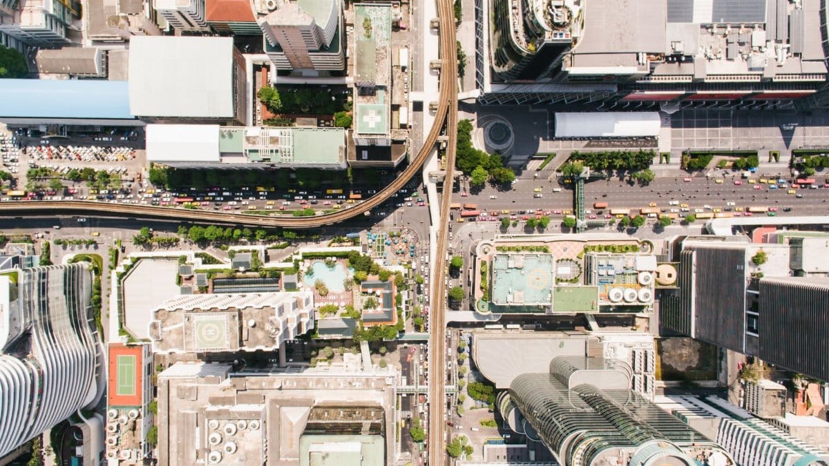 High-angle shot capturing the detailed layout of an urban city center with skyscrapers and roads.