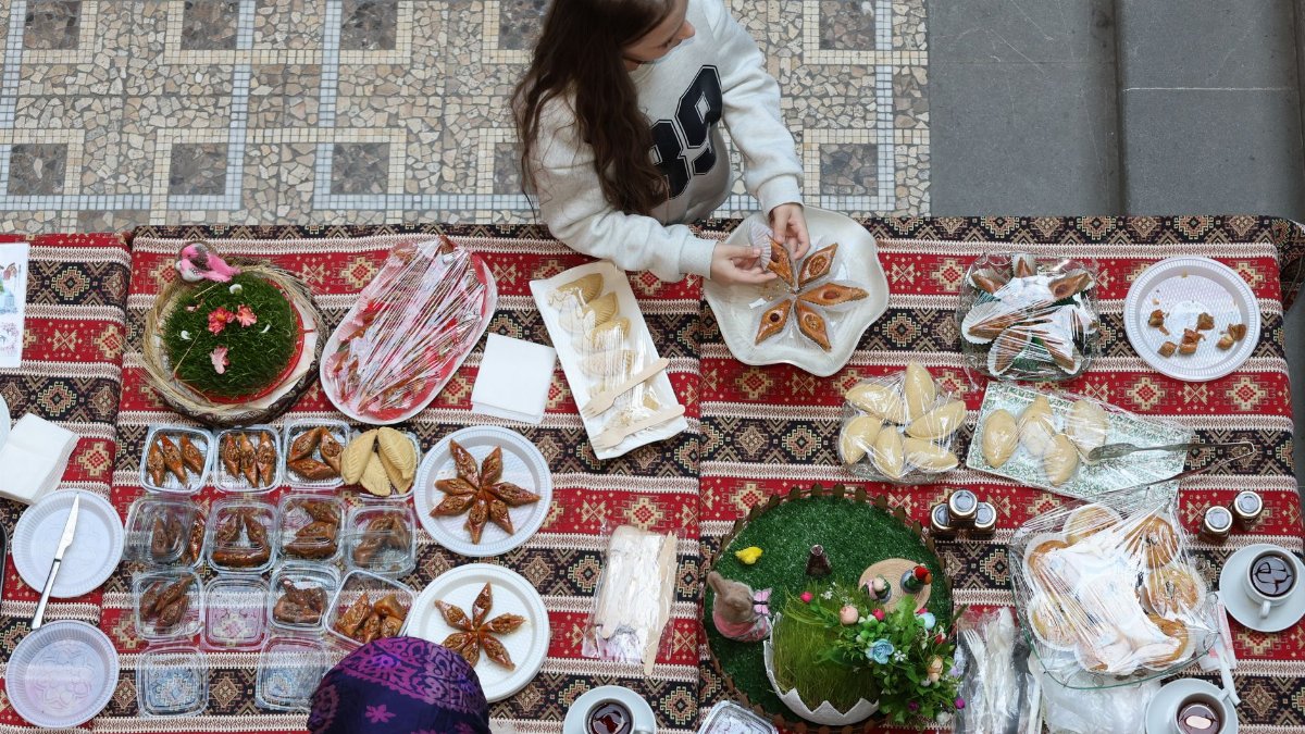 Overhead shot of a traditional food stall with diverse pastries and decorations, offering visual appeal and cultural insight.