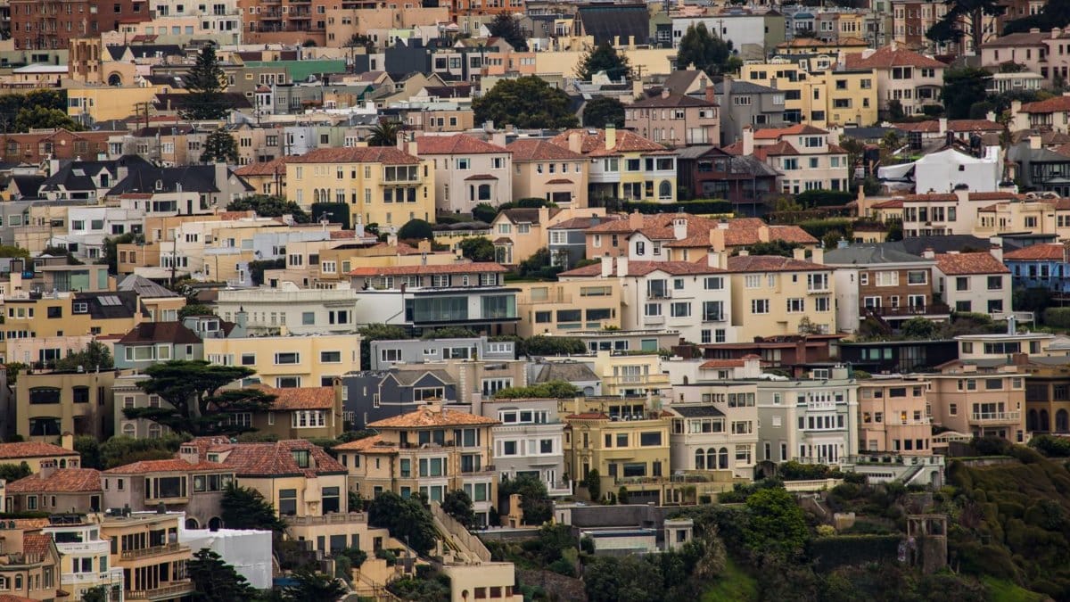 Colorful residential neighborhood in San Francisco with diverse architecture and dense housing.