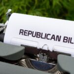 Typewriter displaying 'Republican Bill' in an outdoor setting.