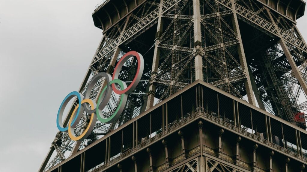 Close-up of the Eiffel Tower adorned with Olympic rings in Paris.