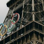 Close-up of the Eiffel Tower adorned with Olympic rings in Paris.