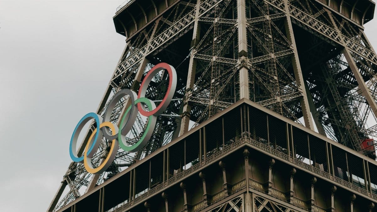Close-up of the Eiffel Tower adorned with Olympic rings in Paris.
