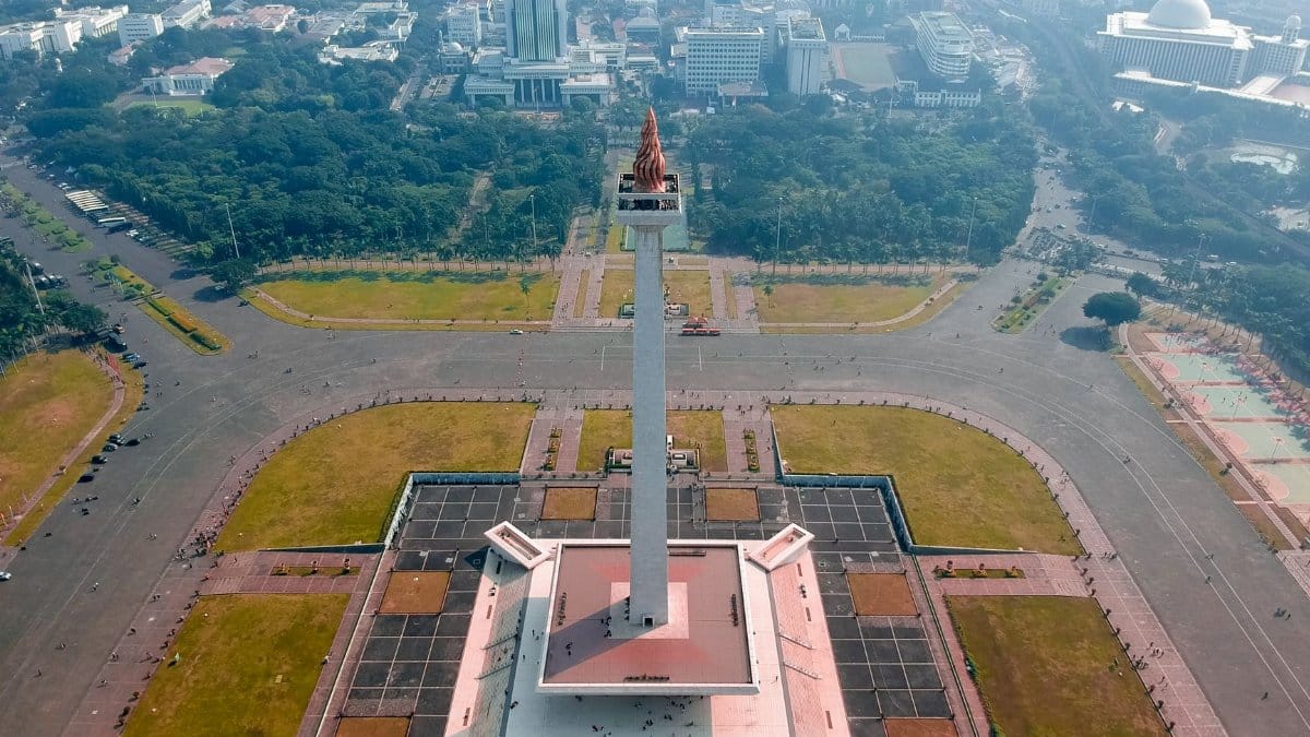 A drone shot capturing the iconic National Monument in Jakarta, Indonesia.