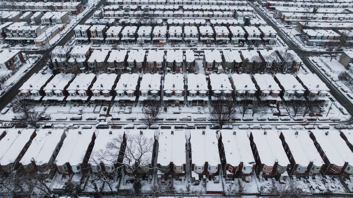 Aerial photograph of snow-covered row houses in Philadelphia, PA during winter.