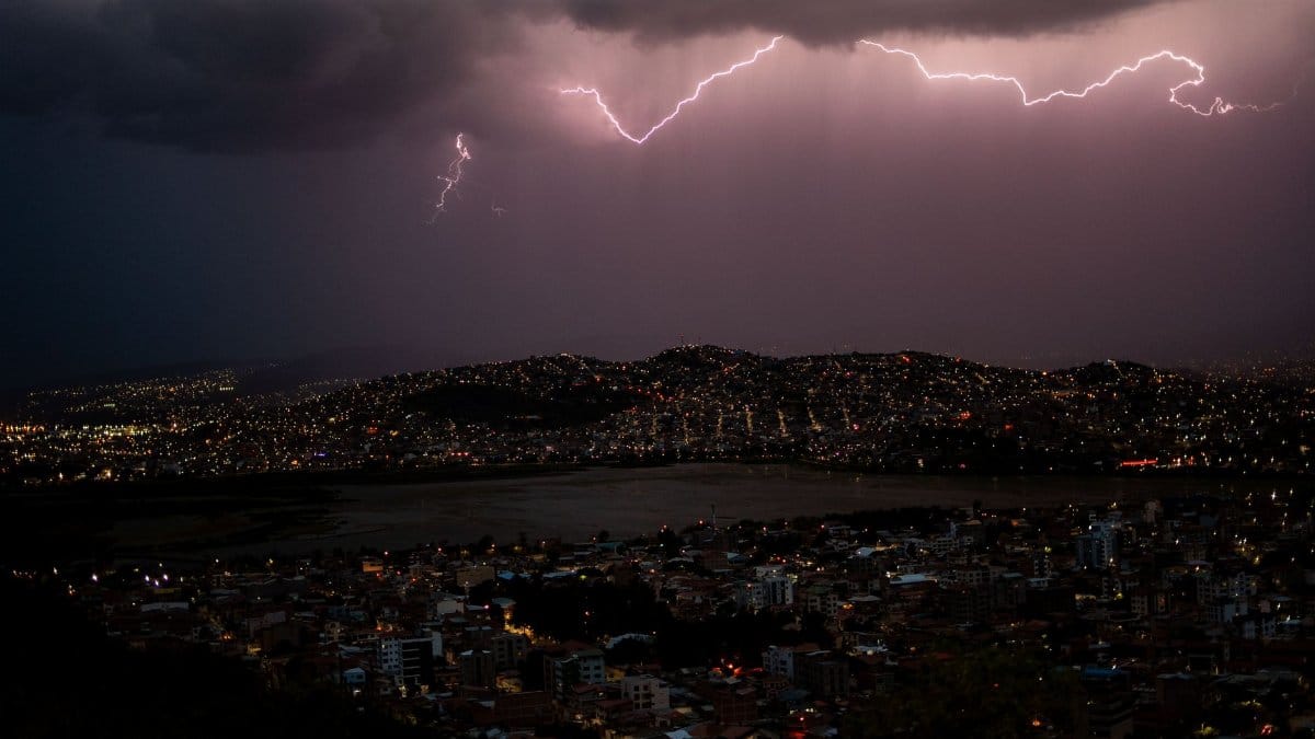 Dramatic lightning storm above Cochabamba, Bolivia, illuminating the city nightscape.