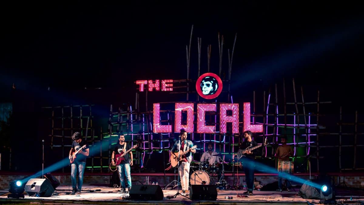 Energetic live music performance by a band on stage at The Local venue, Raipur.