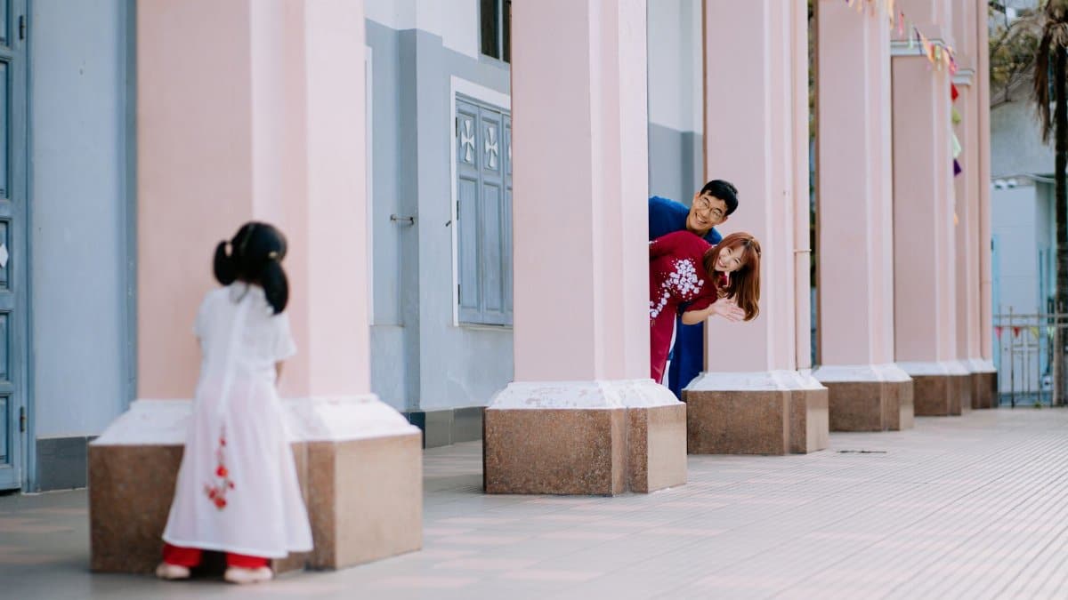 A family enjoying a playful game of hide and seek outdoors, capturing moments of joy and bonding.