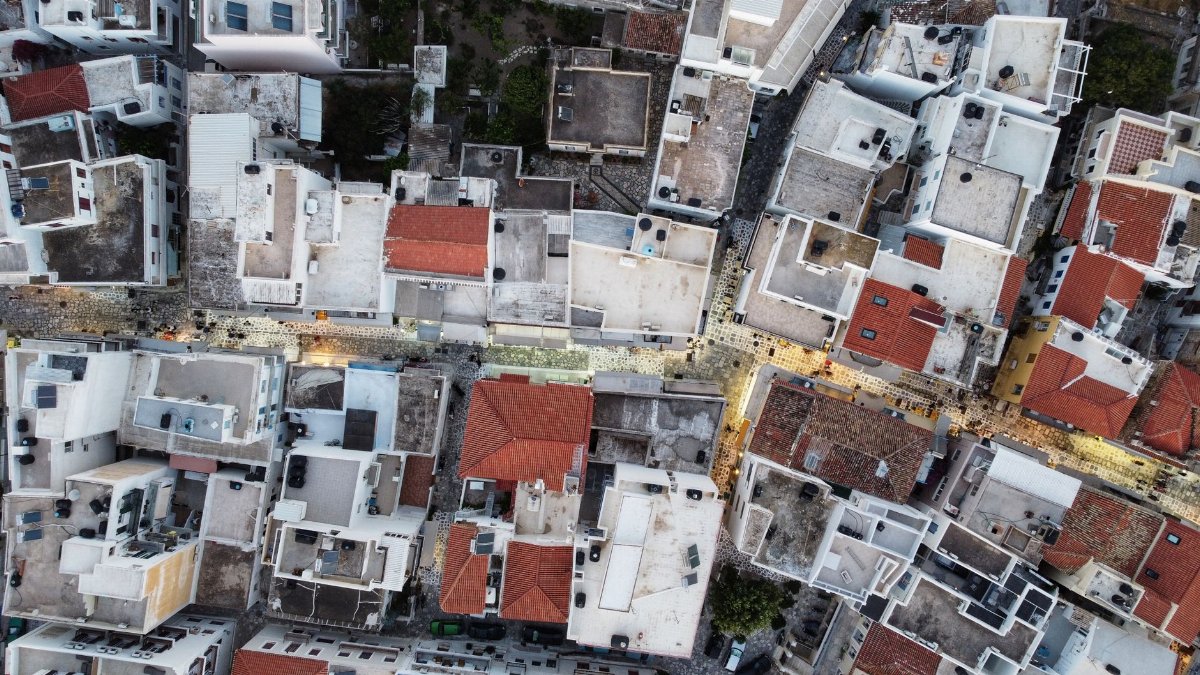 Top view of Tinos, Greece showcasing the urban architecture and street layout from above.