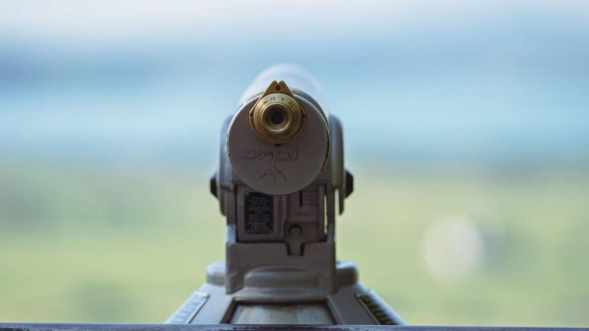 Close-up of a public telescope focusing on a scenic outdoor landscape, capturing a serene view.