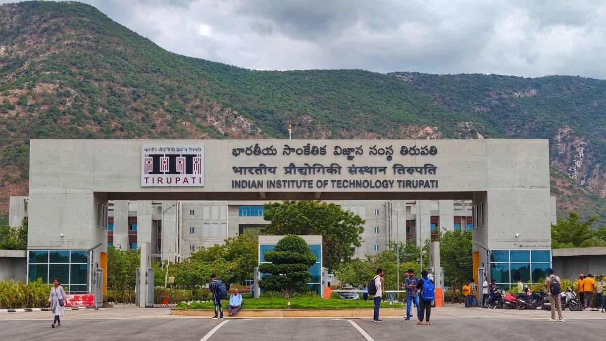 Main entrance of Indian Institute of Technology Tirupati with scenic mountains in background.