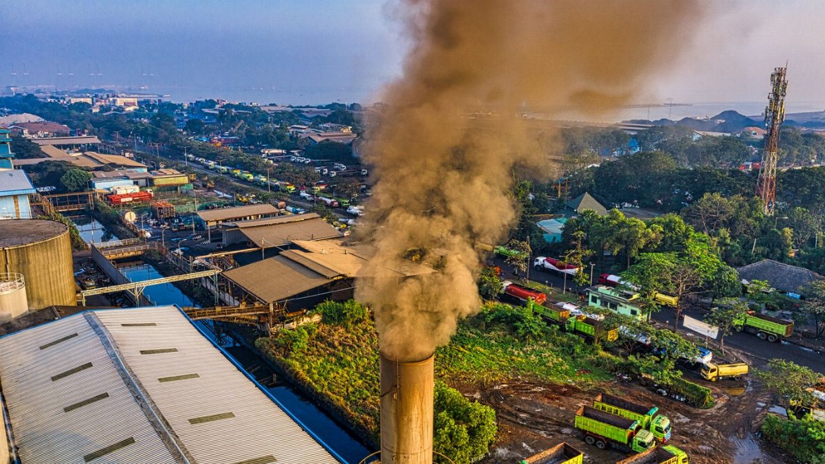 Aerial photograph showcasing air pollution from a factory in Jakarta, Indonesia.