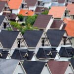 A vivid array of suburban rooftops showcasing diverse colors and architectural designs.