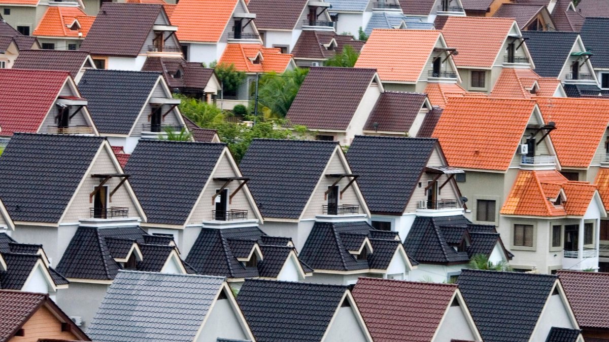 A vivid array of suburban rooftops showcasing diverse colors and architectural designs.