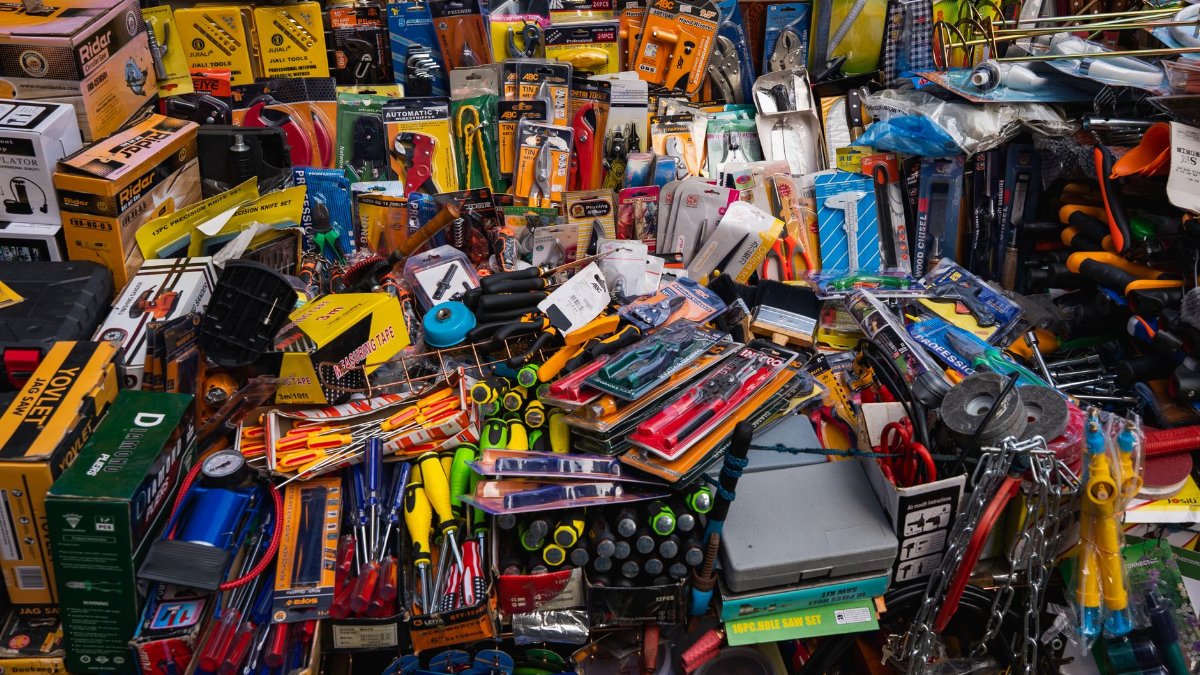 A vibrant display of various tools and hardware items at a market in Colombo, Sri Lanka.