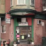A vintage diner facade on a street corner in Boston's historic North End.