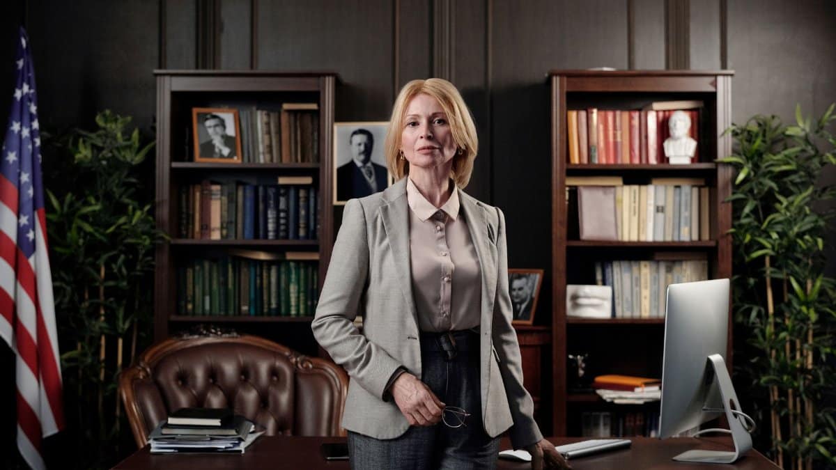 Portrait of a confident businesswoman standing in an elegant office setting.