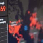 Screen displaying real-time COVID-19 case data with global map and statistics.