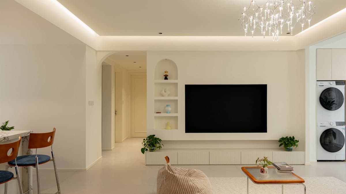 Stylish living room featuring modern minimalist design with elegant lighting and cozy furnishings.