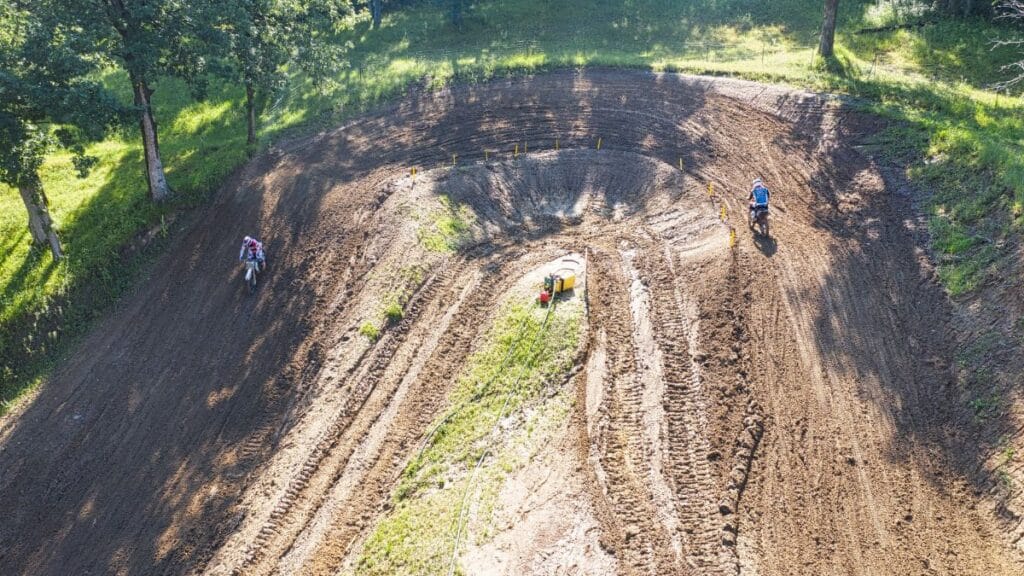 Dynamic aerial shot of a motocross race track in Millville, capturing riders in action.