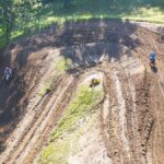 Dynamic aerial shot of a motocross race track in Millville, capturing riders in action.