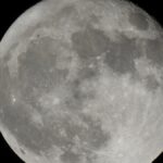 Captivating view of the full moon with clear lunar craters and details.