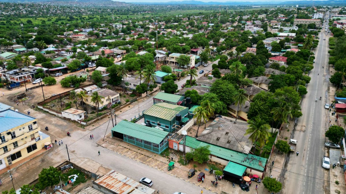 A vibrant aerial view of a city in Africa with lush greenery and urban structures.