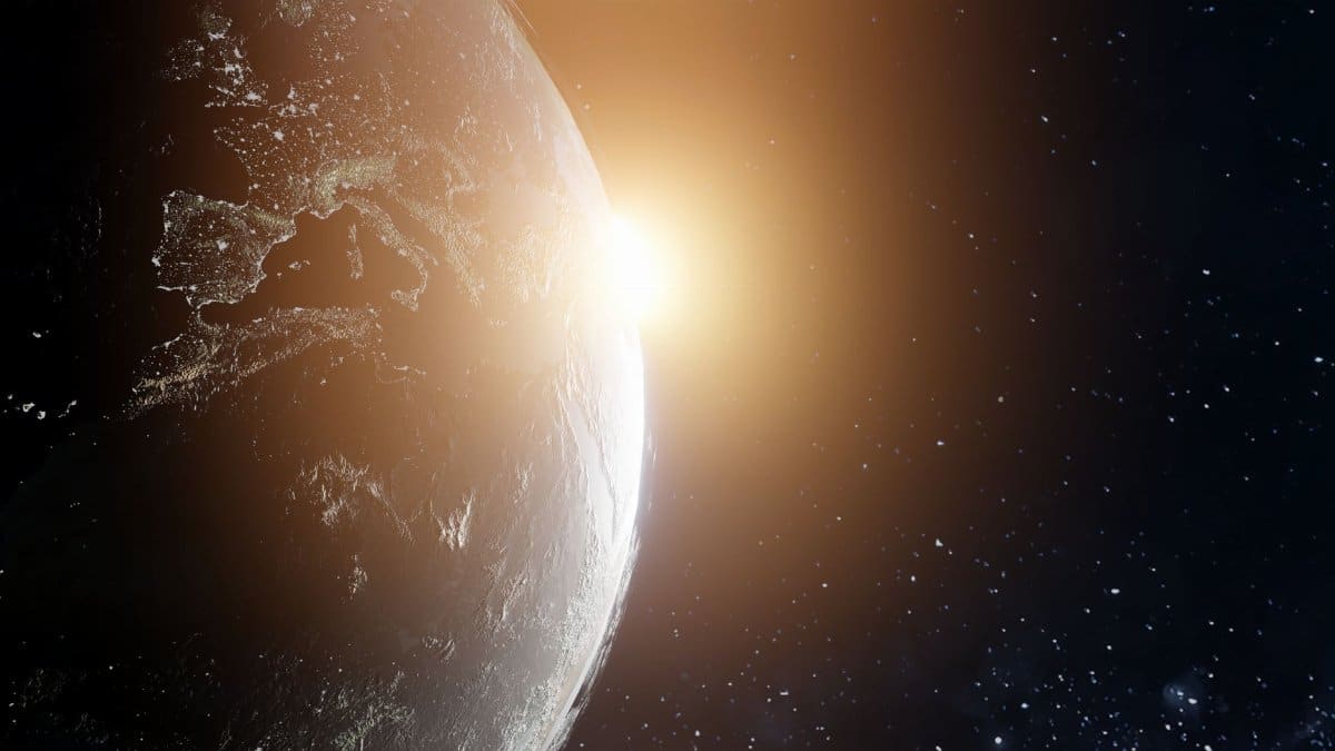 A stunning view of Earth at sunrise from space, highlighting cosmic beauty.