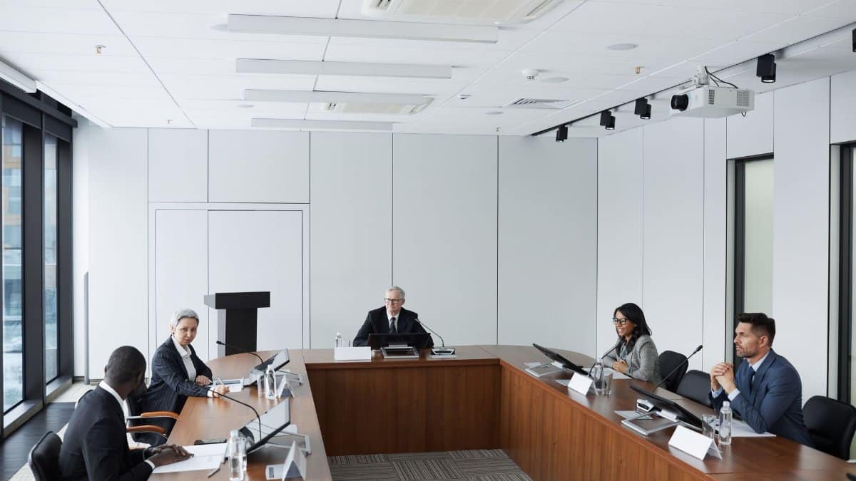 Multicultural business team in a conference room discussing strategies.