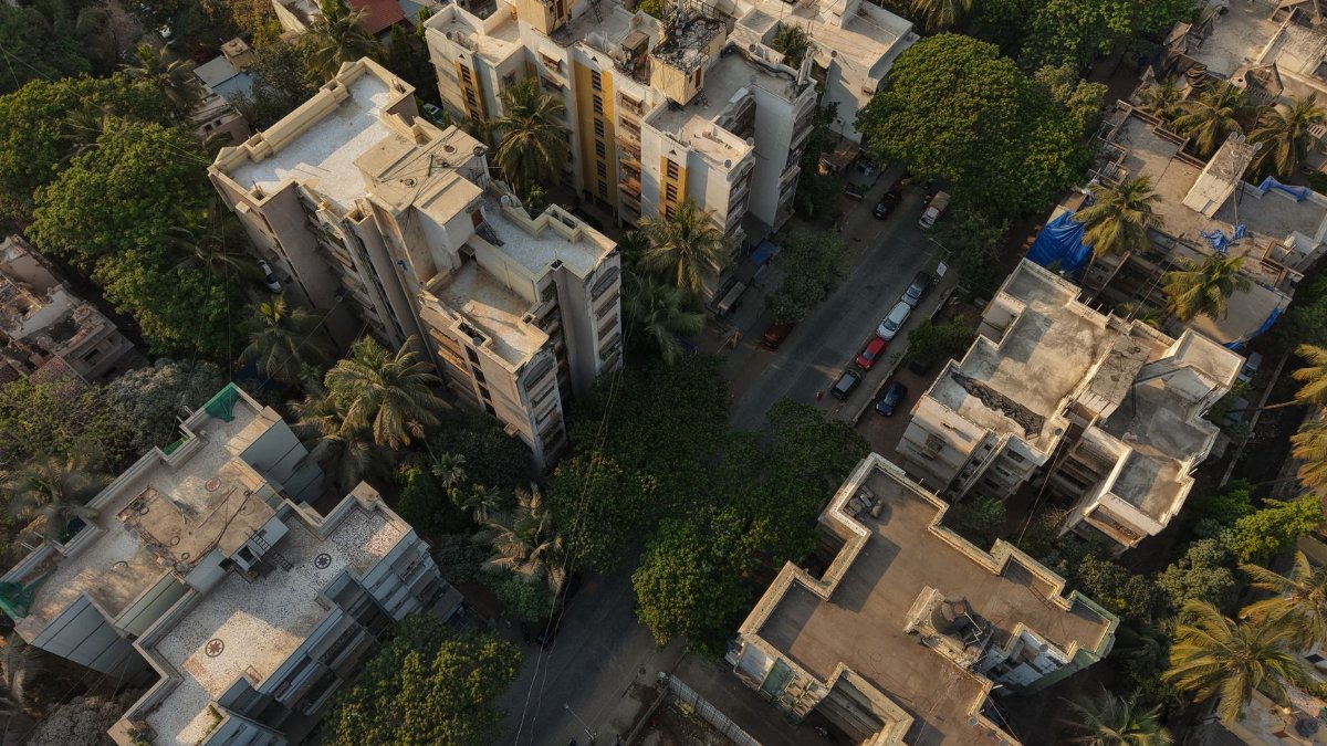 Captivating aerial shot of a Mumbai residential neighborhood surrounded by greenery and city architecture.