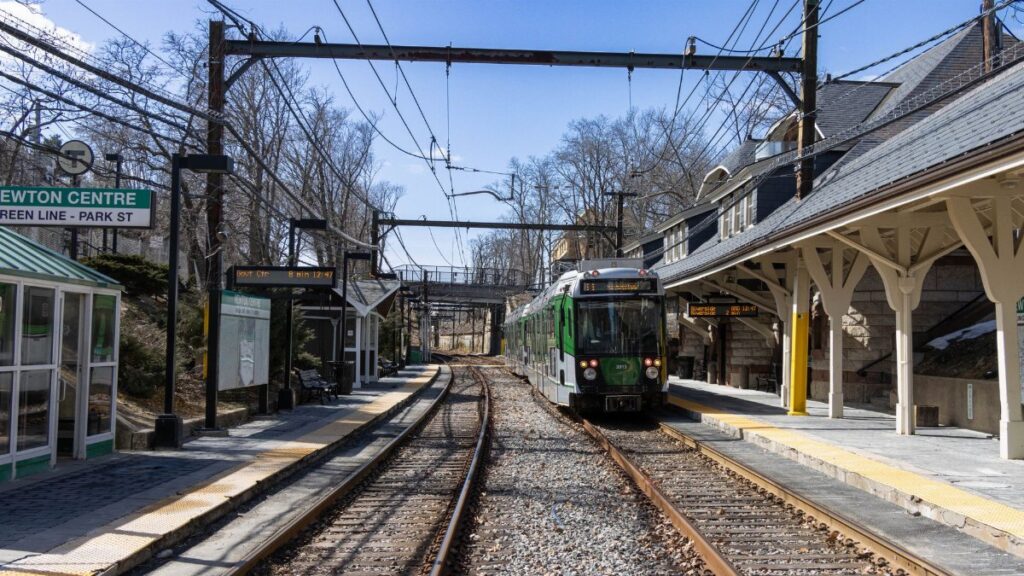 Explore the bustling Newton Centre train station on the Green Line in Massachusetts, USA.