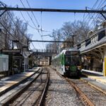 Explore the bustling Newton Centre train station on the Green Line in Massachusetts, USA.