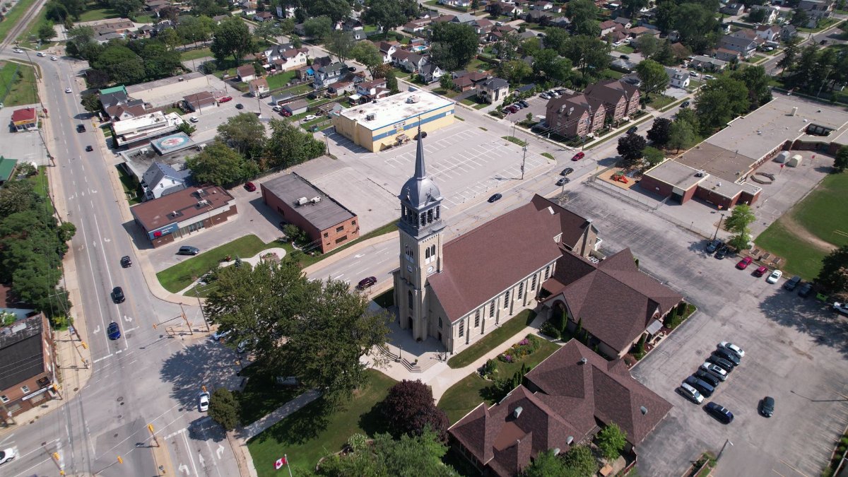 Scenic aerial shot of a church and urban landscape in Windsor, Ontario, during the day.