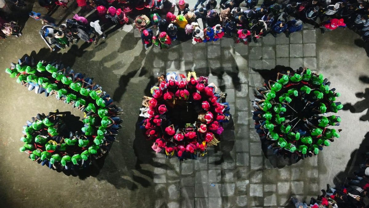 People forming '500' in an overhead gathering in Bagerhat, Bangladesh.