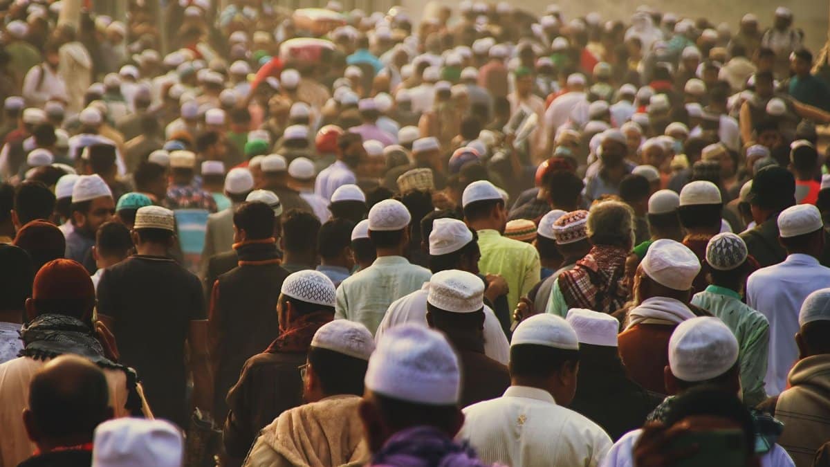 A bustling crowd at a religious gathering in Tongi, Bangladesh, showcasing cultural diversity.