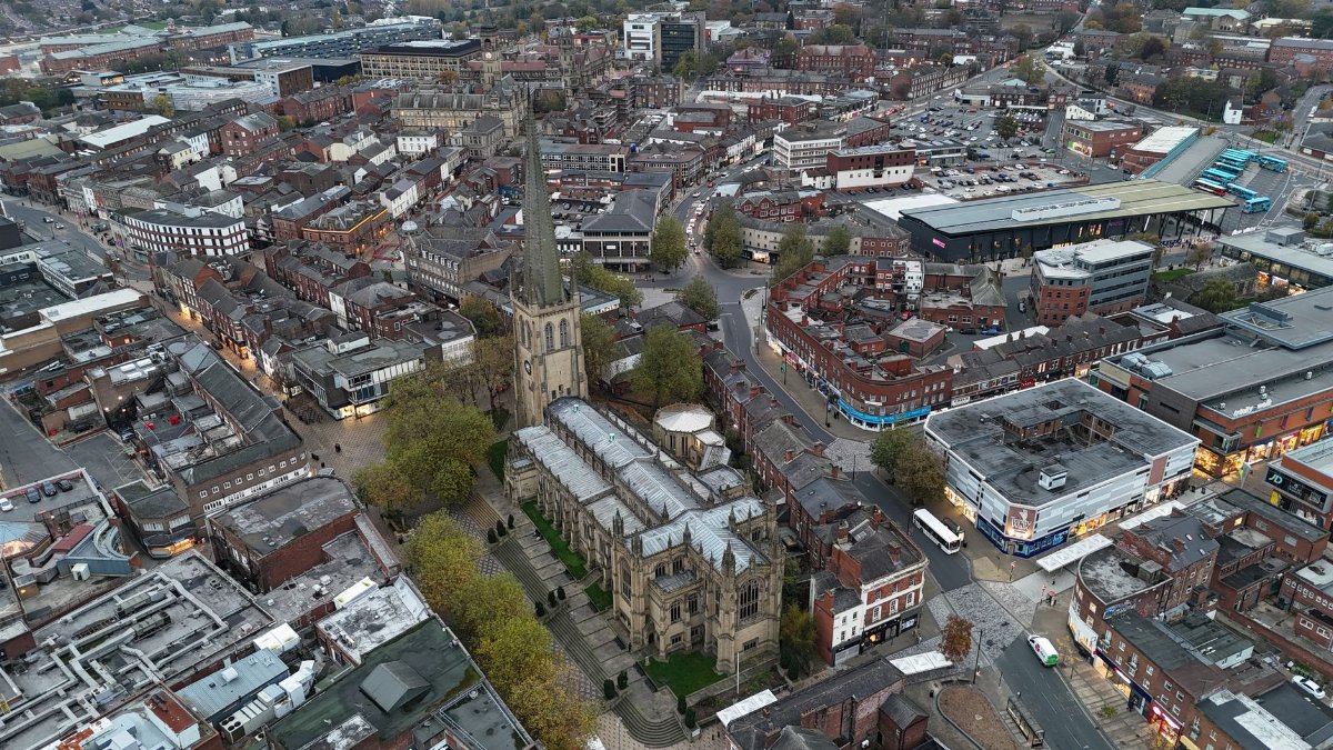 Captivating aerial view of Wakefield, showcasing the historic Wakefield Cathedral amidst urban landscape.